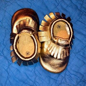 Gold leather fringe moccasins